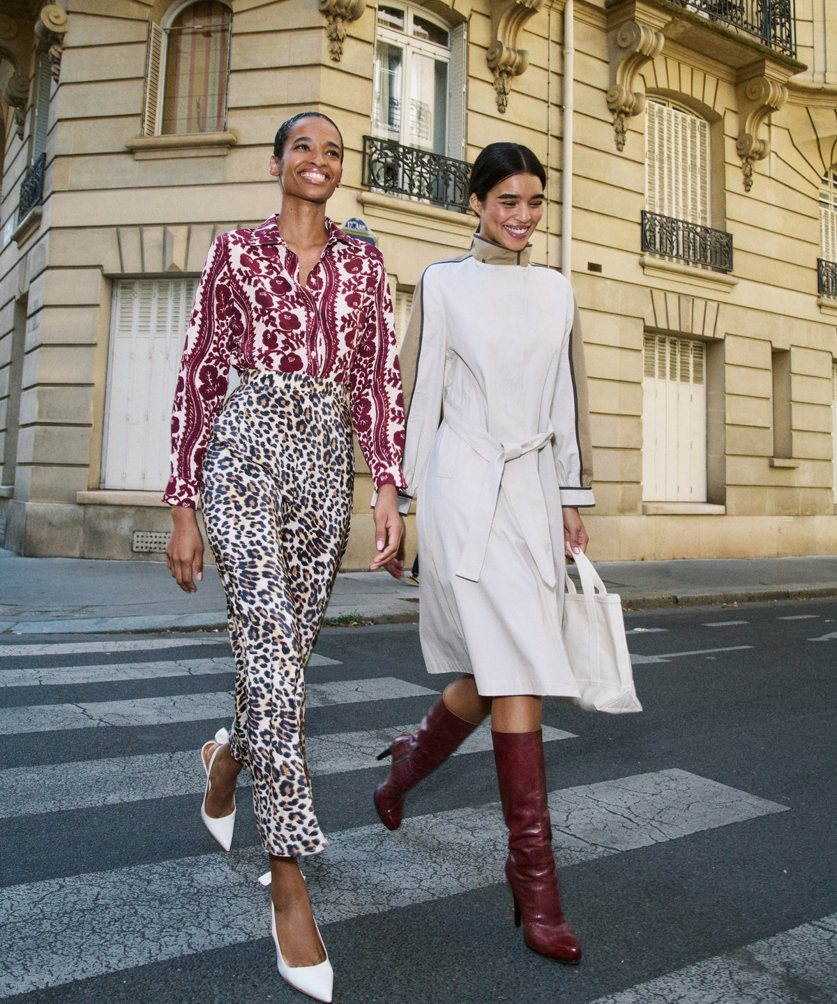 Two women walking in Paris wearing the Fadi Trench Coat